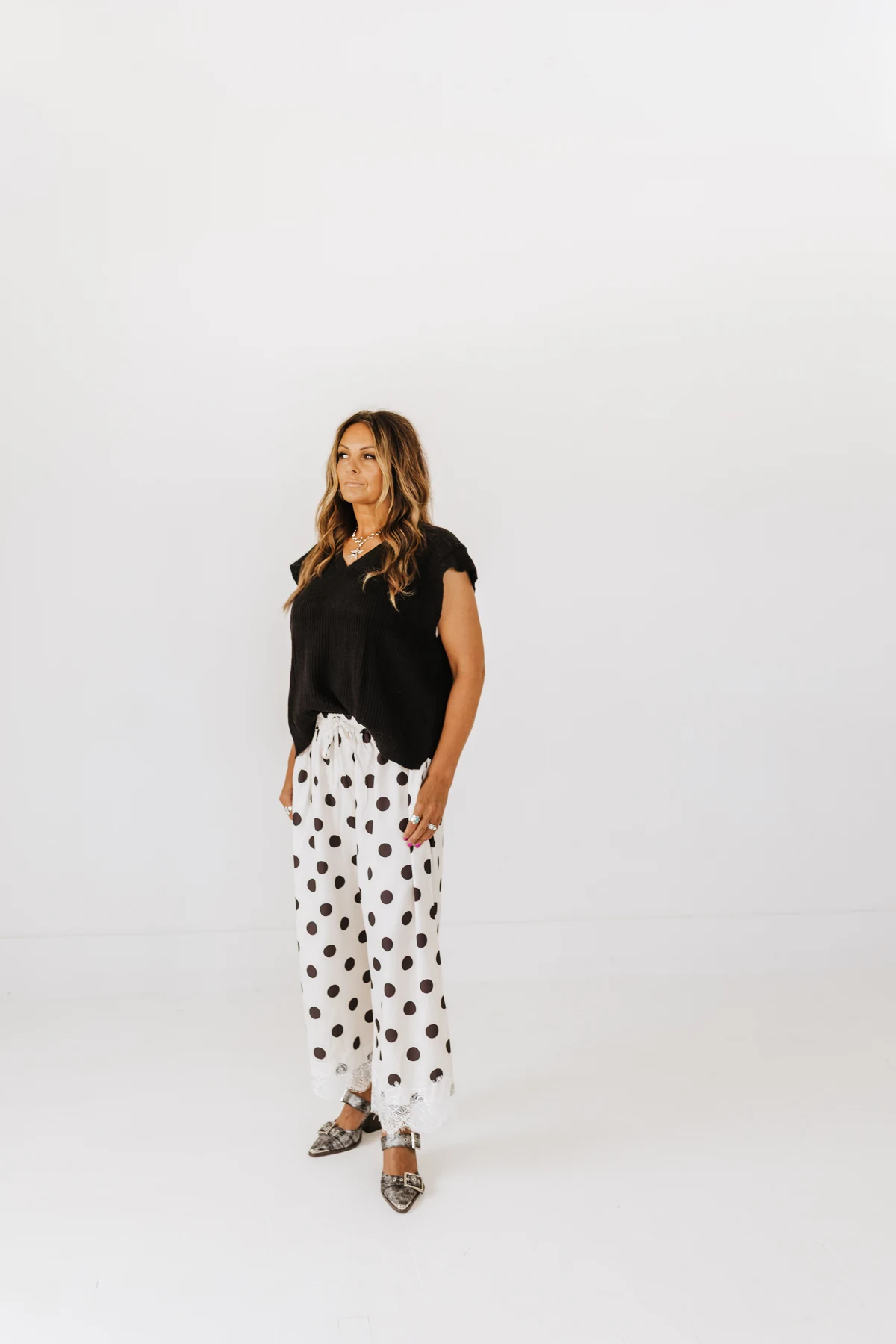 Black lace-hem tank with white polka-dot pants