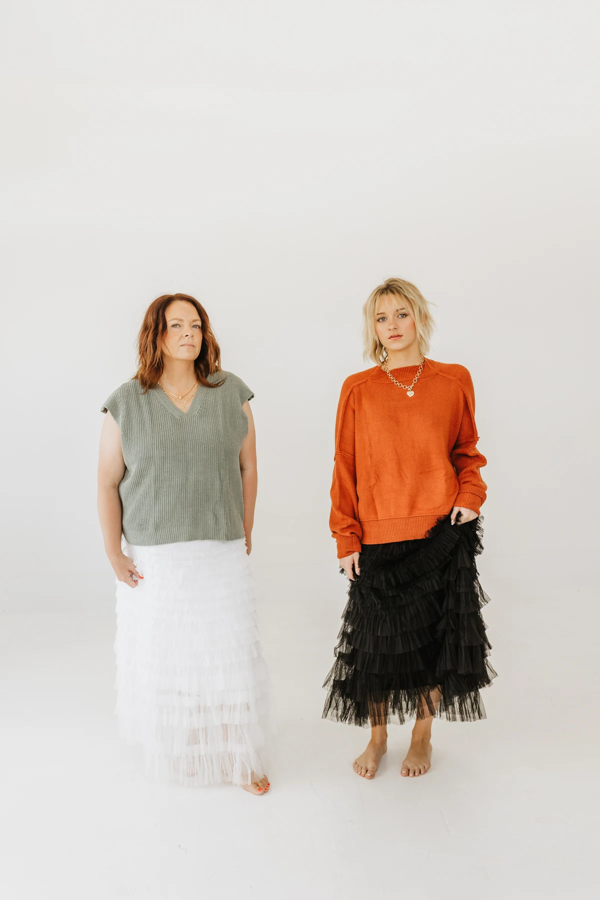 Green and rust knit tops paired with layered ruffle maxi skirts